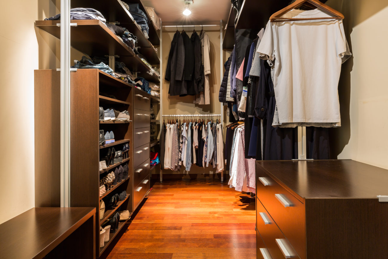 Shot of a walk-in closet full of clothes