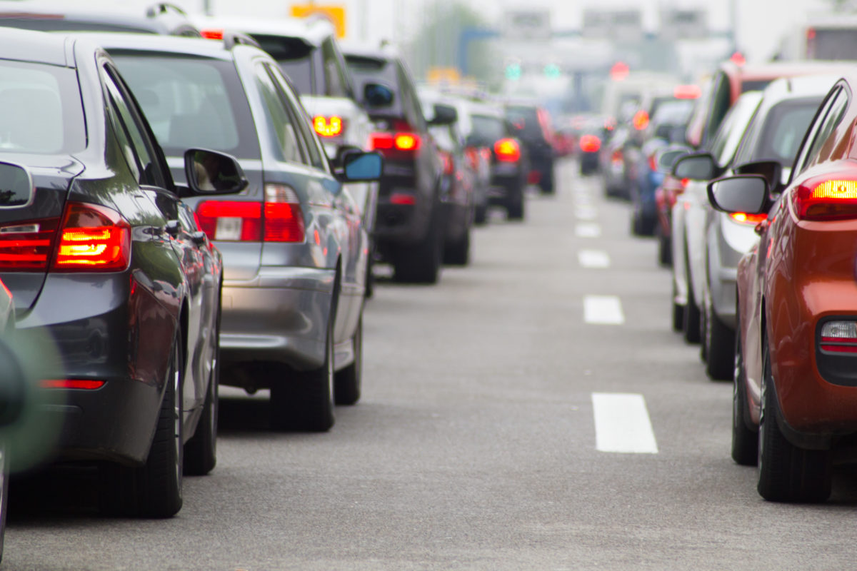 Cars in long row on highway in traffic jam