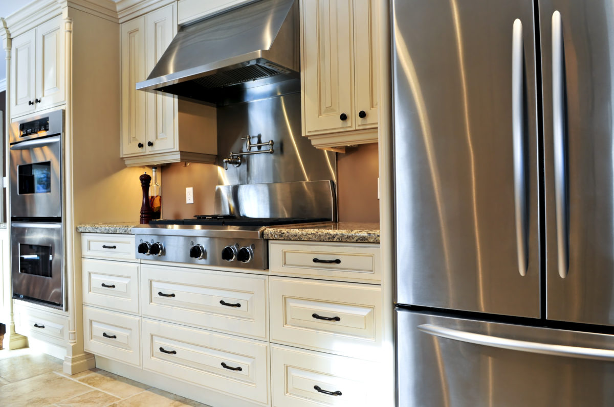 Interior of modern luxury kitchen with stainless steel appliances