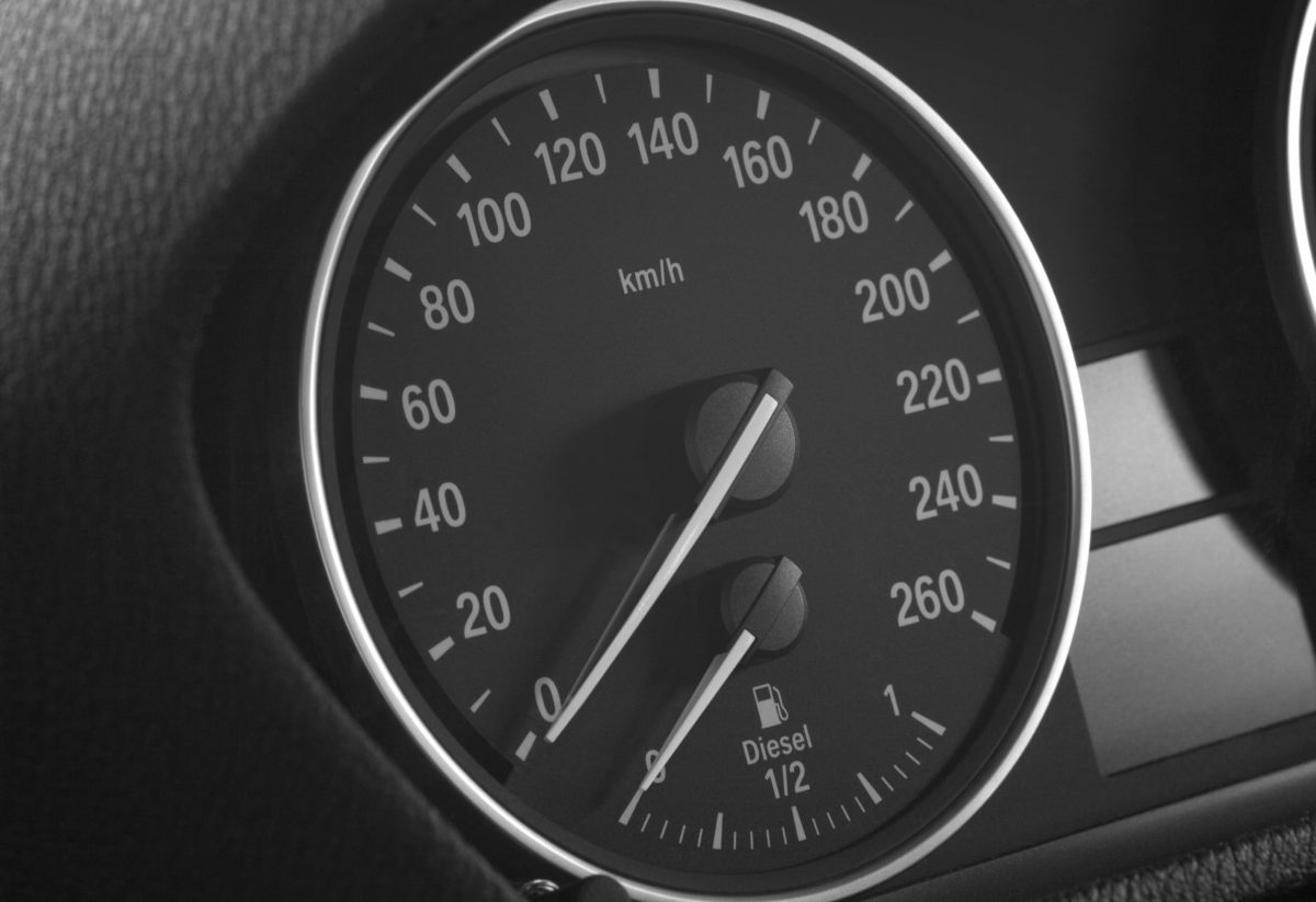 Close up of a car speedometer and diesel level indicato