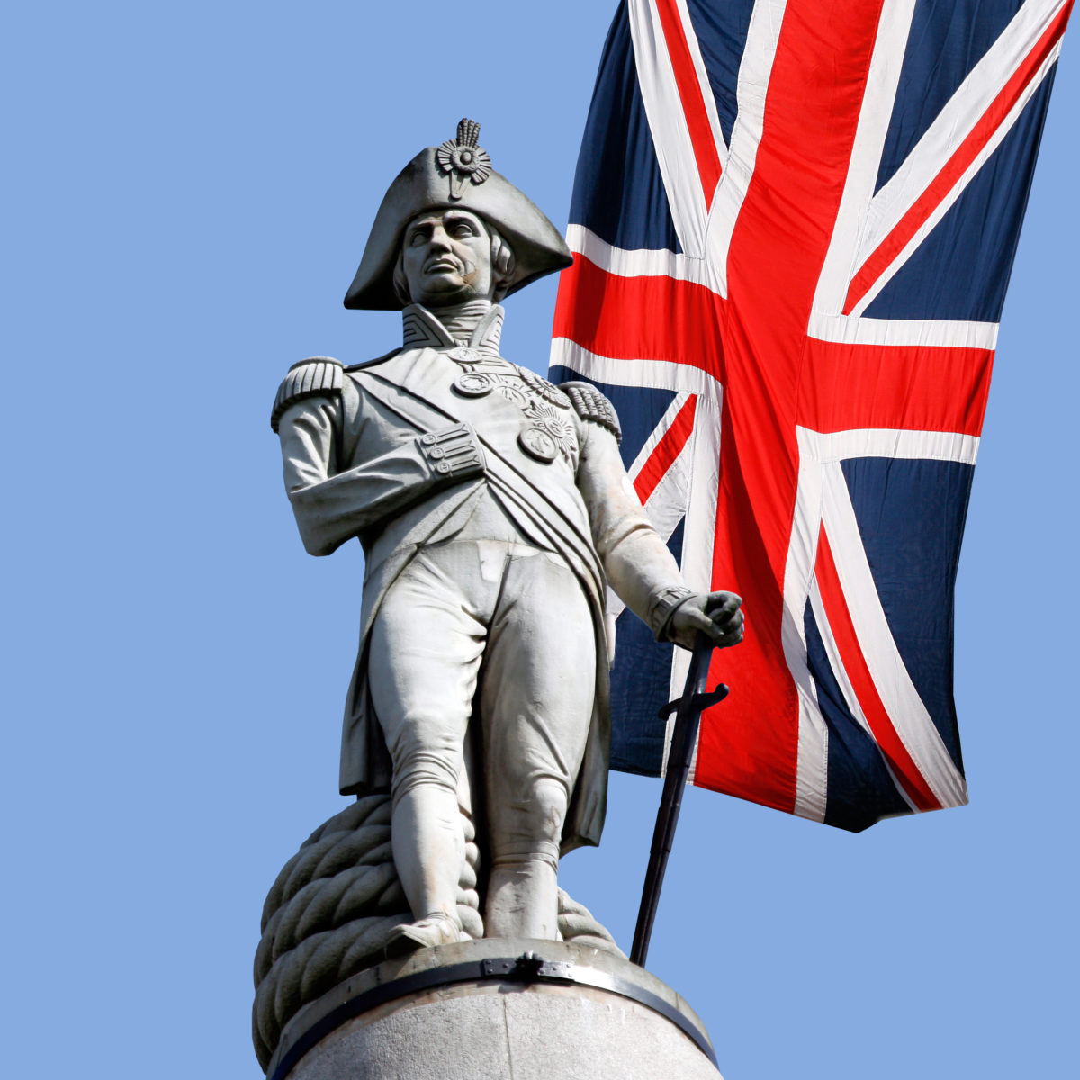 Nelson statue over Union Jack in Trafalgar Square