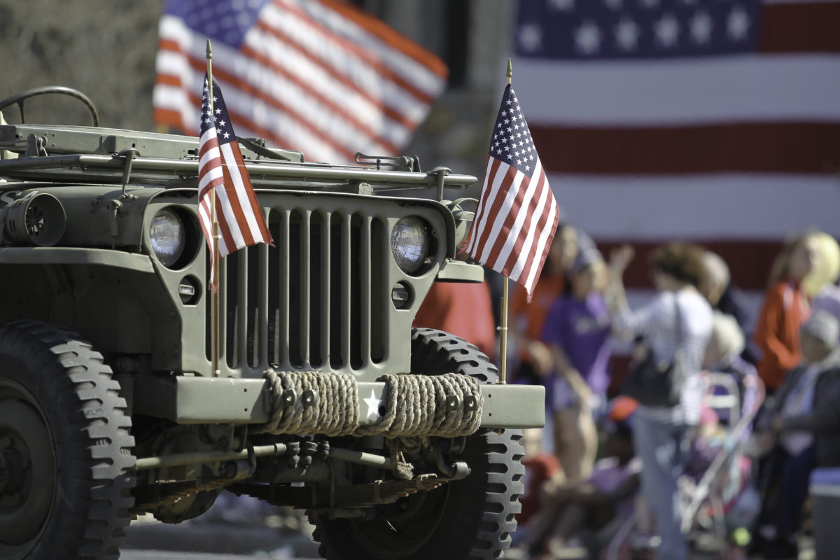 Military Jeep with flags in Parade